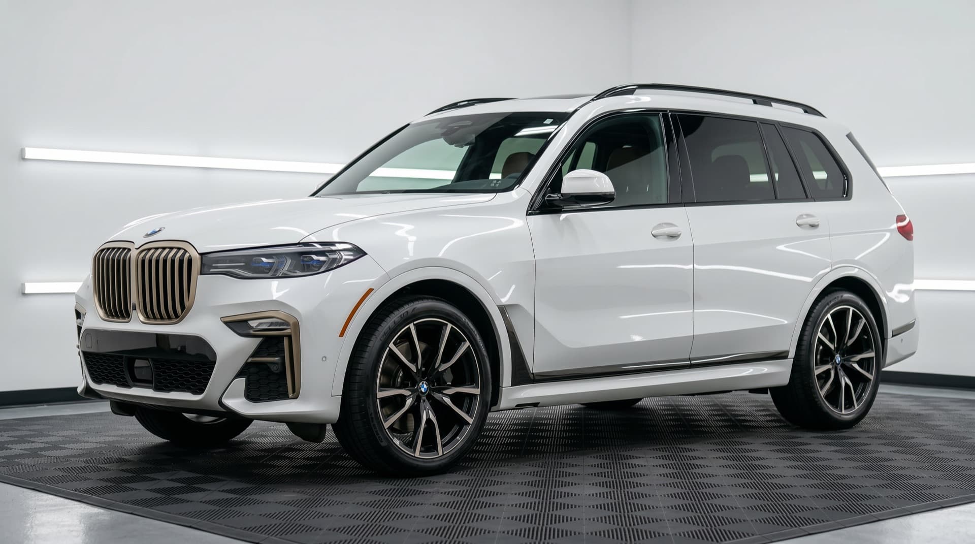 Same BMW X7 at pickup — fully detailed, decontaminated, and sealed; gloss and color restored